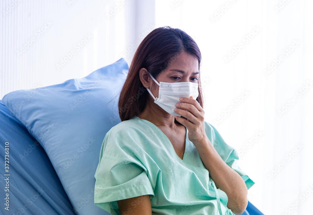 COVID-19, Corona Virus outbreak, quarantine and epidemic spread concept. Asian depressed CORONA or COVID-19 patient infection wear mask and get blood transfusion in quarantine room at the hospital COVID-19, Corona Virus outbreak, quarantine and epidemic spread concept. Asian depressed CORONA or COVID-19 patient infection wear mask and get blood transfusion in quarantine room at the hospital