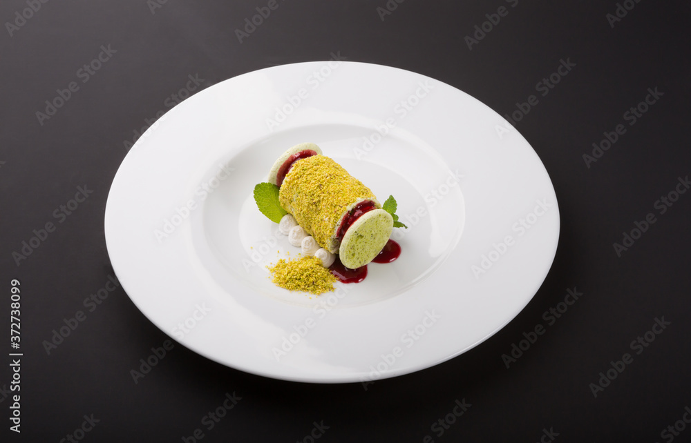 Pistachio italian dessert on white plate Pistachio italian dessert on white plate