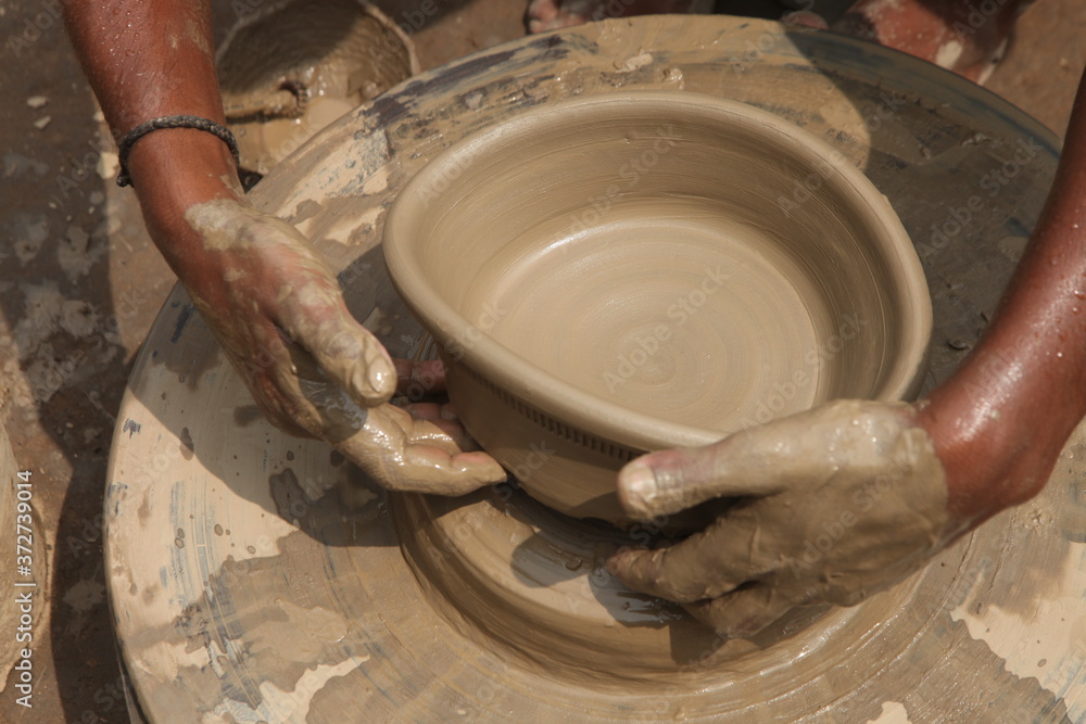 Potter at work, clay molding, man work clay, potter man Potter at work, clay molding, man work clay, potter man
