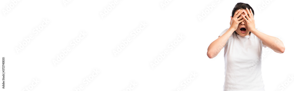 horizontal concept of scared young woman in white t-shirt covering face isolated on white horizontal concept of scared young woman in white t-shirt covering face isolated on white