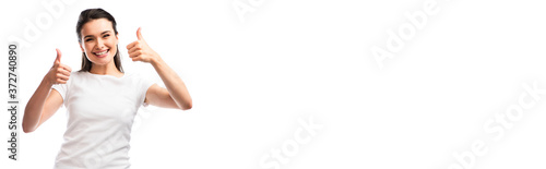 panoramic crop of young woman in white t-shirt showing thumbs up isolated on white