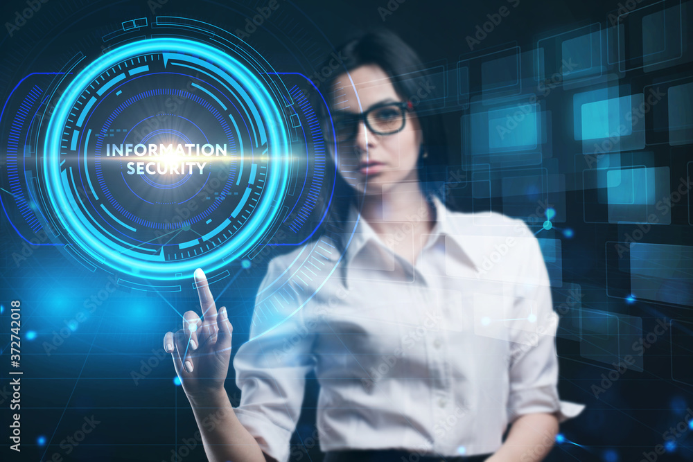 Business, Technology, Internet and network concept. Young businessman working on a virtual screen of the future and sees the inscription: Business, Technology, Internet and network concept. Young businessman working on a virtual screen of the future and sees the inscription: