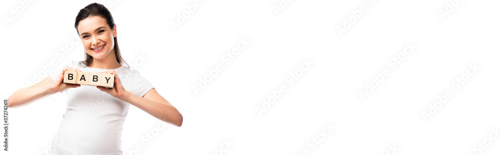 horizontal image of young pregnant woman in white t-shirt holding wooden cubes with baby lettering isolated on white horizontal image of young pregnant woman in white t-shirt holding wooden cubes with baby lettering isolated on white