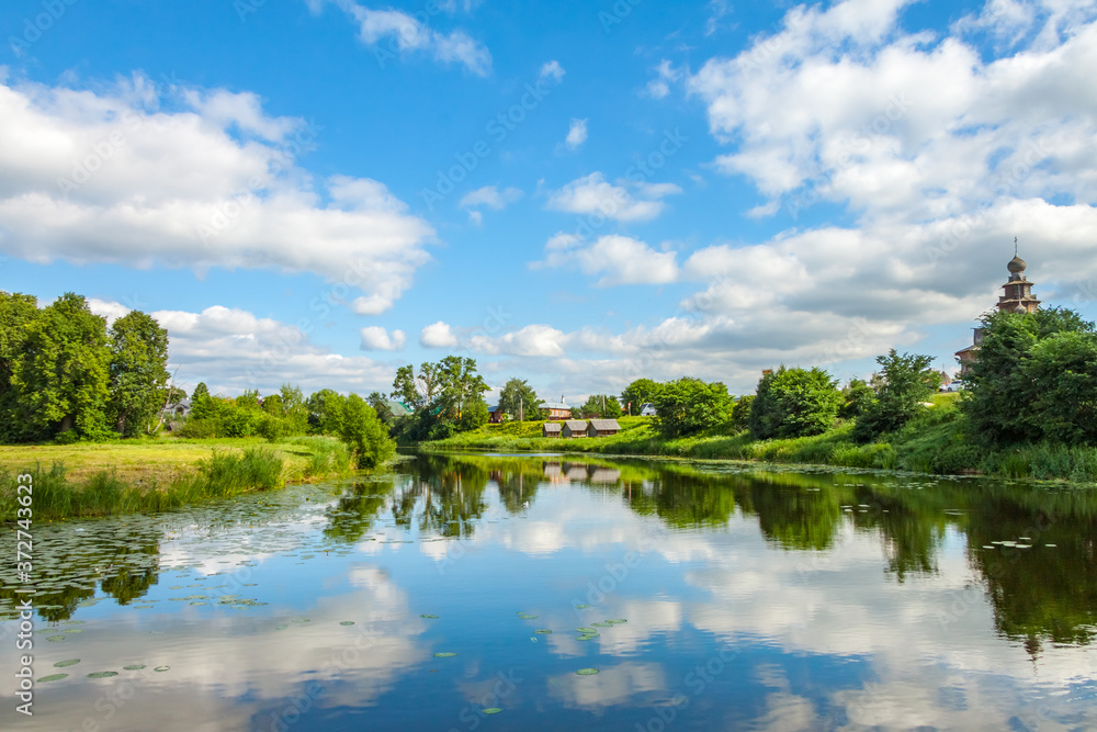 View of the Kamenka river in Suzdal, Russia. Beautiful summer landscape.