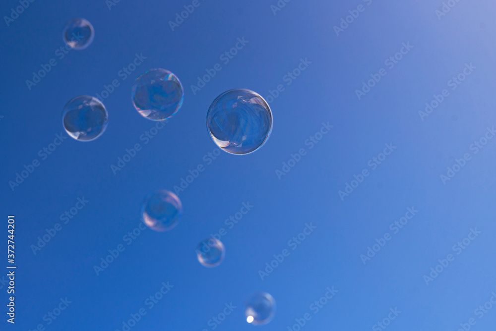 soap bubbles on blue sky soap bubbles on blue sky