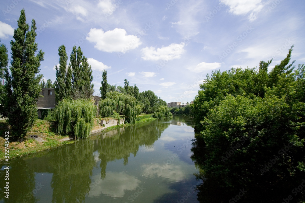 River in the city on a summer day River in the city on a summer day