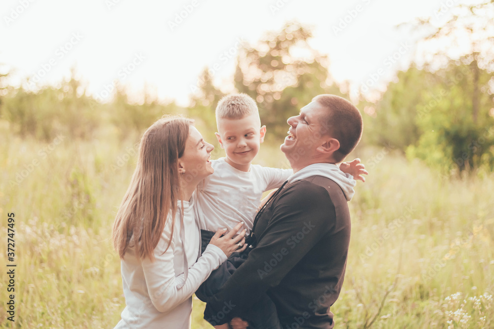 Family in tracksuits hugging and laughing
Family in tracksuits hugging and laughing