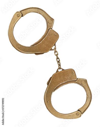 There is a pair of golden handcuffs. White background. Isolated. photo