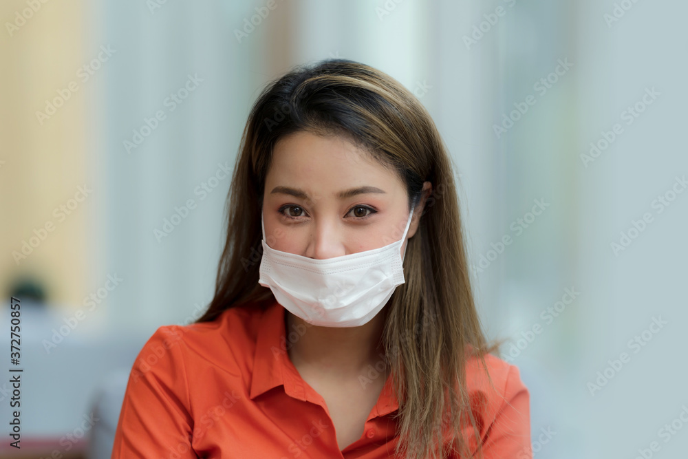 Portrait of young woman wearing face mask protective sitting in cafe Portrait of young woman wearing face mask protective sitting in cafe