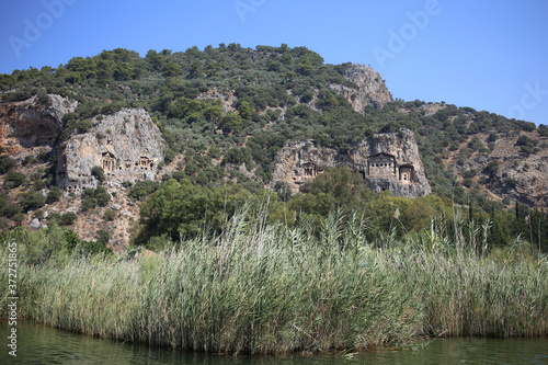 View of the ancient Lycian tombs carved into the rock, over the Dalyan river in Turkey.