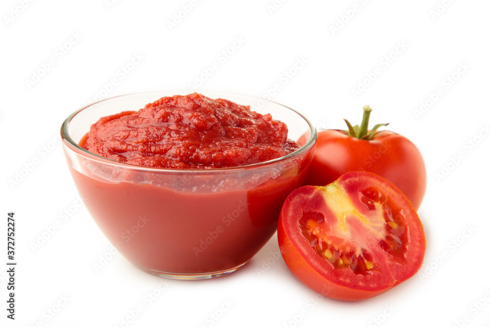 Fresh tomatoes with paste isolated on white background Fresh tomatoes with paste isolated on white background
