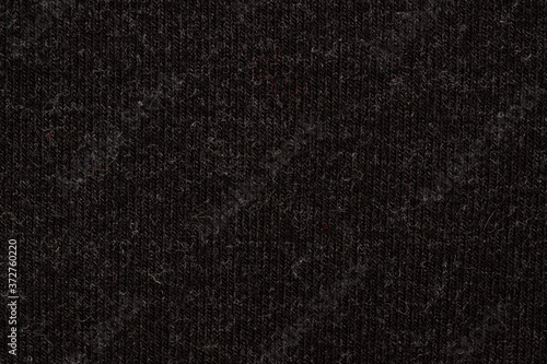 knitted melange fabric simple weave of black and gray threads © Елена Челышева