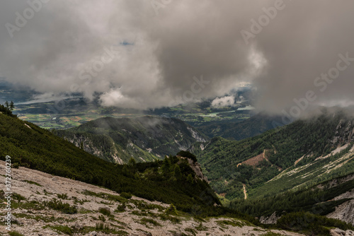 View on Drau river valley from path to Mittagskogel hill in cloudy summer day