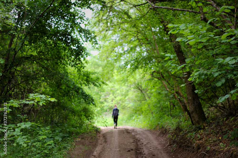 girl walking in the woods