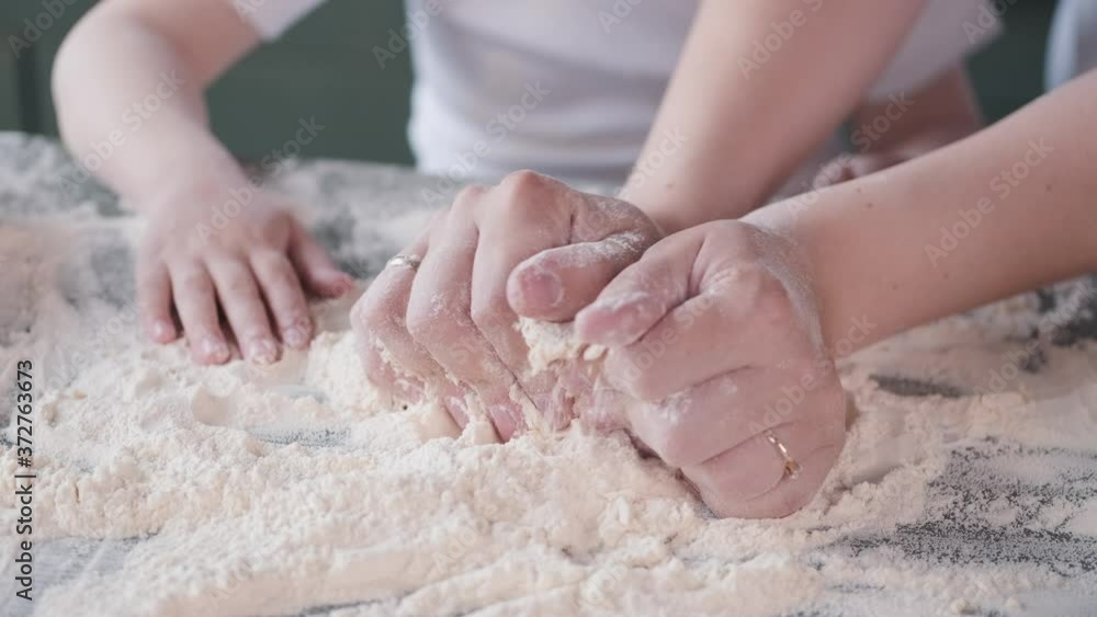Family in a kitchen. Beautiful mother with little son. Little boy playing wit a dough. Family in a kitchen. Beautiful mother with little son. Little boy playing wit a dough.