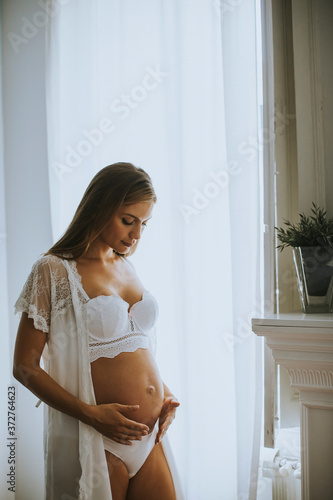 Pretty young pregnant woman...