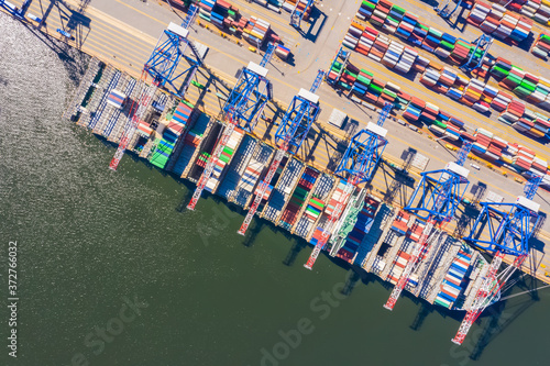 Logistics and transportation of Container Cargo ship and Cargo import/export and business logistics, Shipping , Top view ,Aerial view from drone © netsay