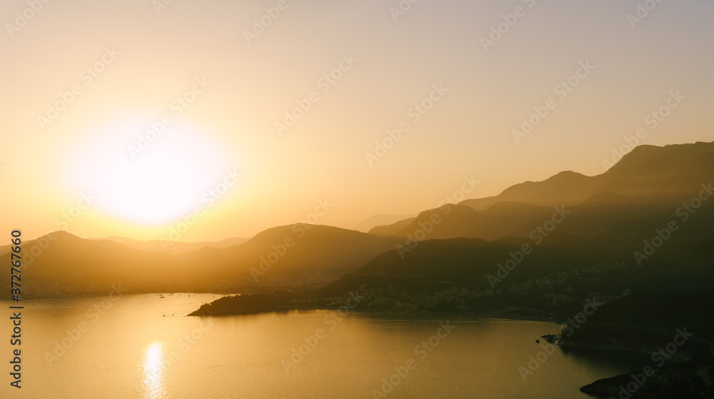 Sunset over mountains and sea, Budva, Montenegro.