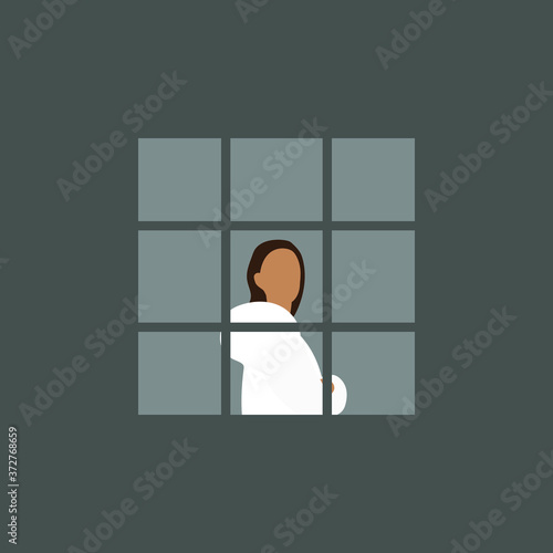 Woman at the window behind bars