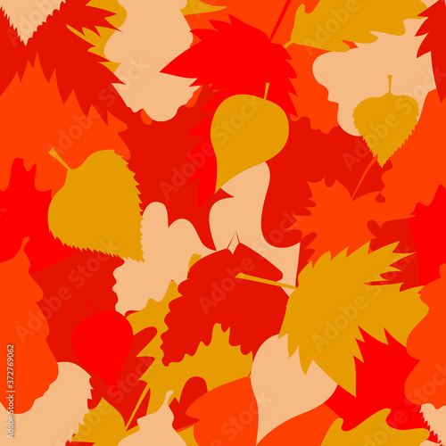 
Seamless pattern with autumn leaves. Bright ornament dominated by yellow, red and orange colors
