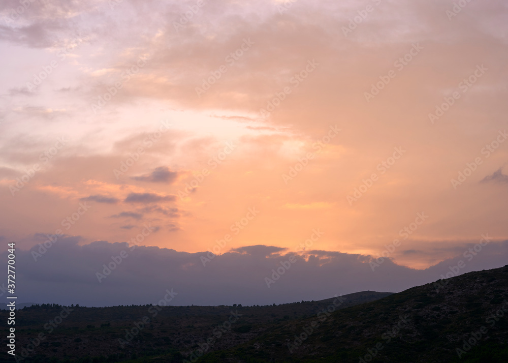 Sunset in the high mountains with clouds Sunset in the high mountains with clouds