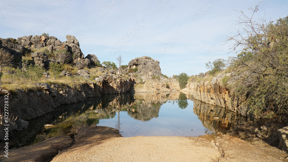 Pond lake situated in lush landscape at Boab Quarry Campsite in Western Australia. Pond lake situated in lush landscape at Boab Quarry Campsite in Western Australia.