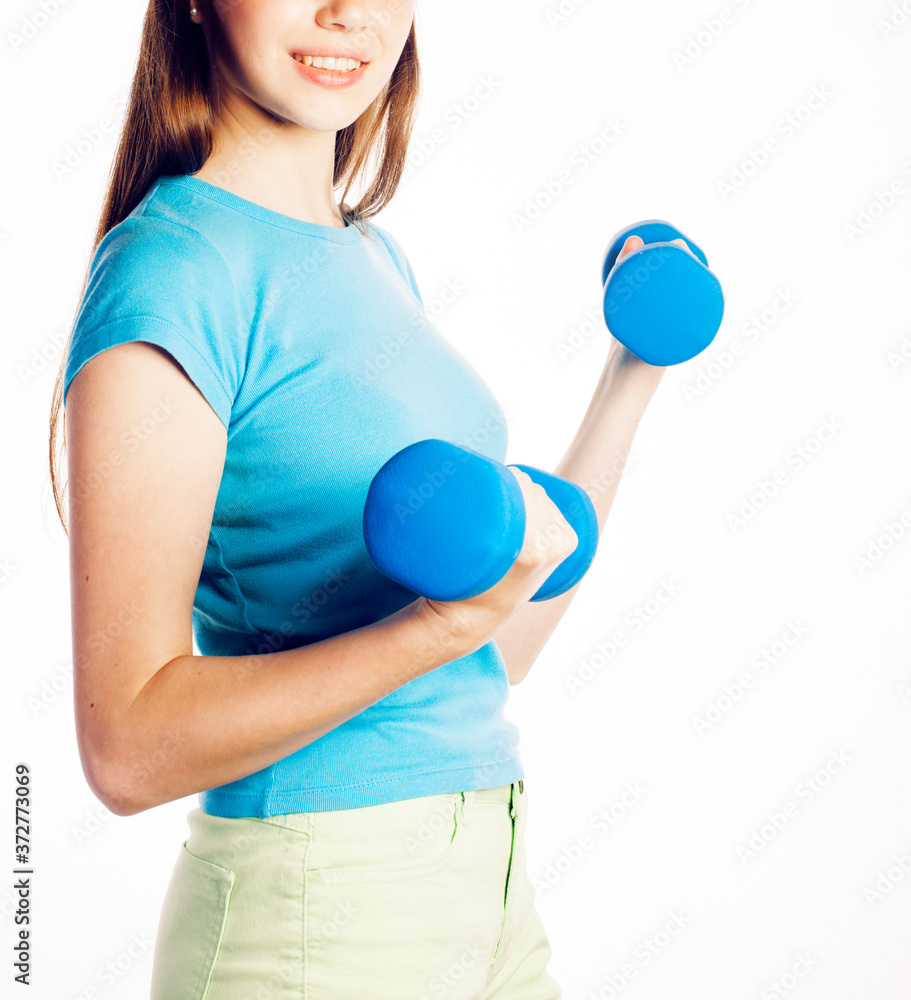 young pretty slim woman with dumbbell isolated on white background, cheerful smiling young pretty slim woman with dumbbell isolated on white background, cheerful smiling