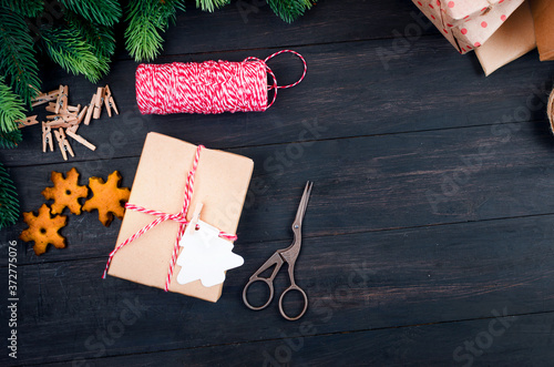 Christmas composition with craft gift boxes on wooden table photo