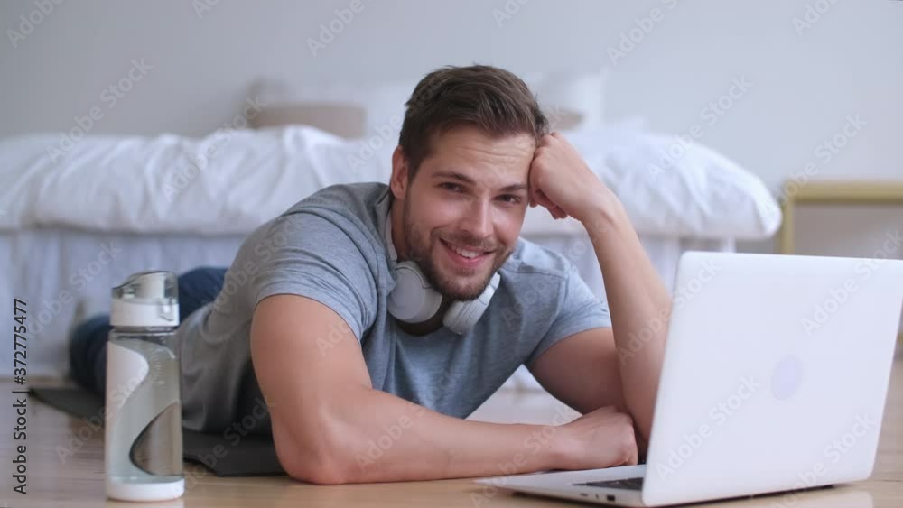 Family fitness at home, Father coach, Sports kid, Fun gymnastics. Young man portrer during online fitness at home Family fitness at home, Father coach, Sports kid, Fun gymnastics. Young man portrer during online fitness at home