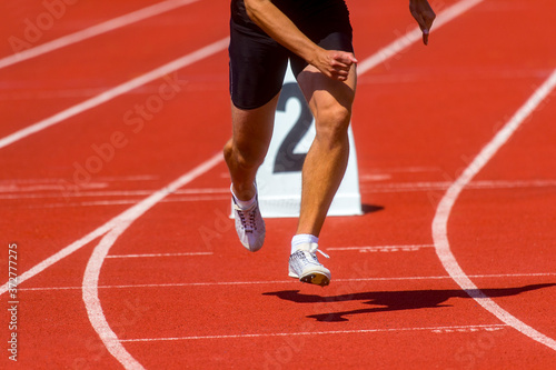 Athletics man running on the track field