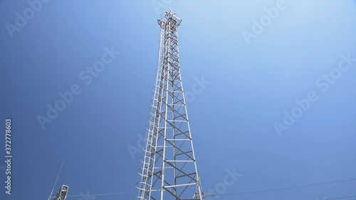 Communication tower at a frequency of 5G against a blue sky