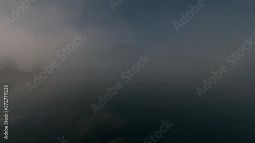 Mountains and lake time-lapse shot. Early morning sunrise before a hot summer day in Bavaria Germany.