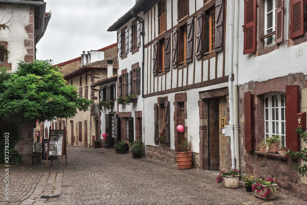 City of pilgrimage Saint-Jean-Pied-de-Port in the Antlantic Pyrenees. Station on the Way of St. Jacob. The Pilgrim's Way. Tourist location. Popular cities in France. Europe's narrow cobbled street.