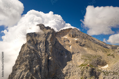 aerial view of the corno grande wrapped in clouds in the mountain area of gran sasso italy abruzzo and the franchetti refuge photo