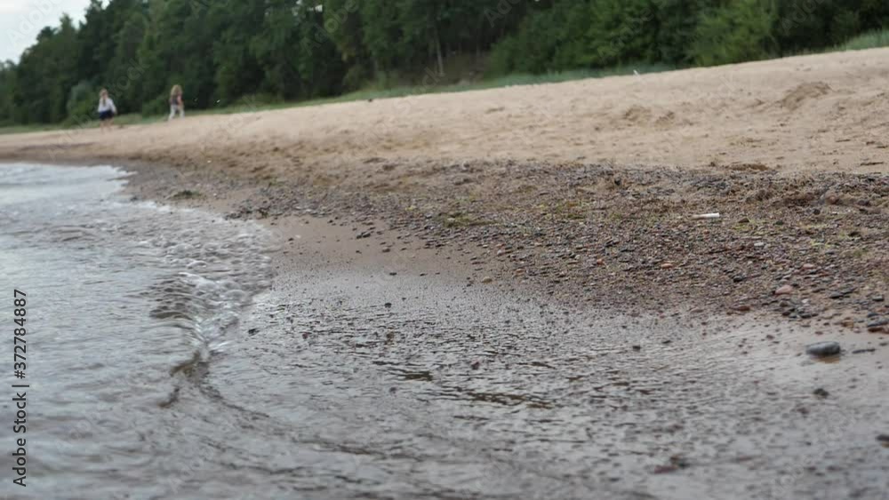 The children played in the distance along the sea shore The children played in the distance along the sea shore