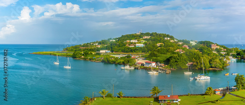 A panorama view over Castries, St Lucia towards the airport in the morning photo