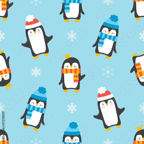 Seamless pattern with penguins isolated on blue background.