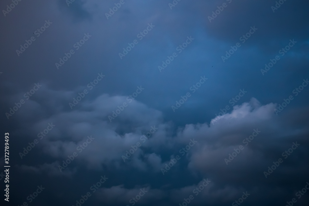 Fluffy clouds cover the summer blue sky Fluffy clouds cover the summer blue sky