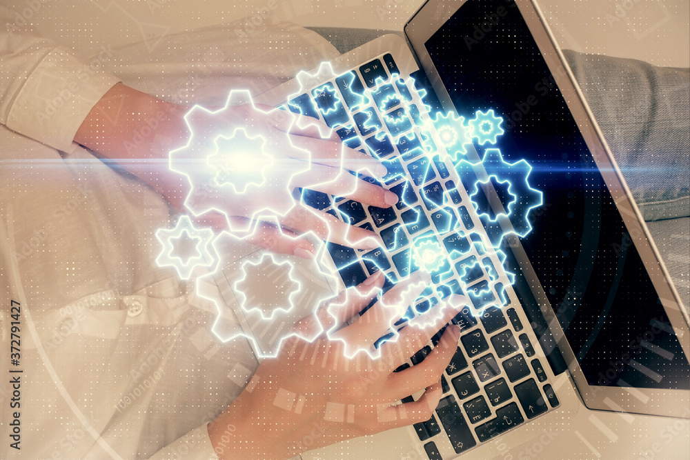 Double exposure of woman hands working on computer and financial theme hologram drawing. Top View. Business concept. Double exposure of woman hands working on computer and financial theme hologram drawing. Top View. Business concept.