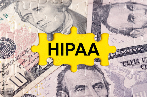 Puzzle with the image of dollars in the center of the inscription -HIPAA