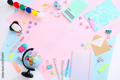 Flat lay of stationery on pink background