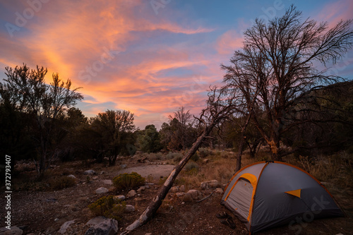 Sunset with beautiful afterglow with a tent