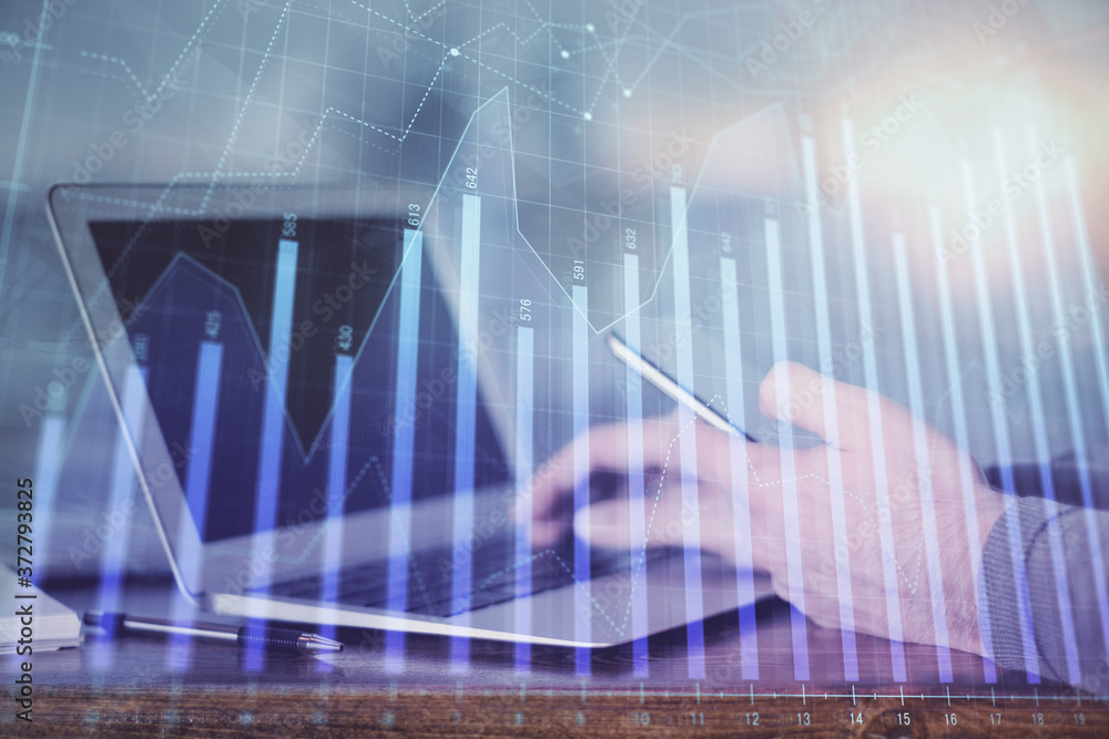 Double exposure of man's hands holding and using a digital device and forex graph drawing. Financial market concept. Double exposure of man's hands holding and using a digital device and forex graph drawing. Financial market concept.