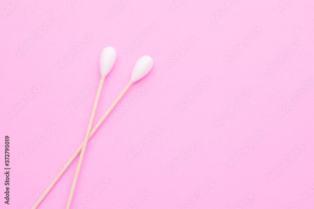 Top view cotton bud for cleaning the ears on pink
