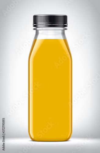 Plastic Bottle with oranges Juice on background. 