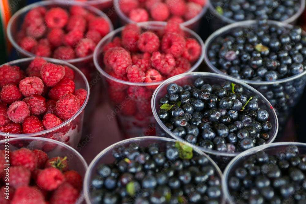 background of raspberries and blueberries in the market background of raspberries and blueberries in the market