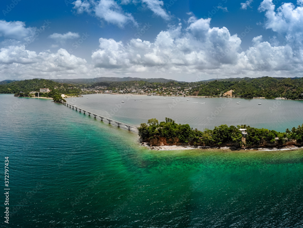 Aerial drone view of bridge to the island in Samana bay, Santa Barbara, Dominican Republic 
