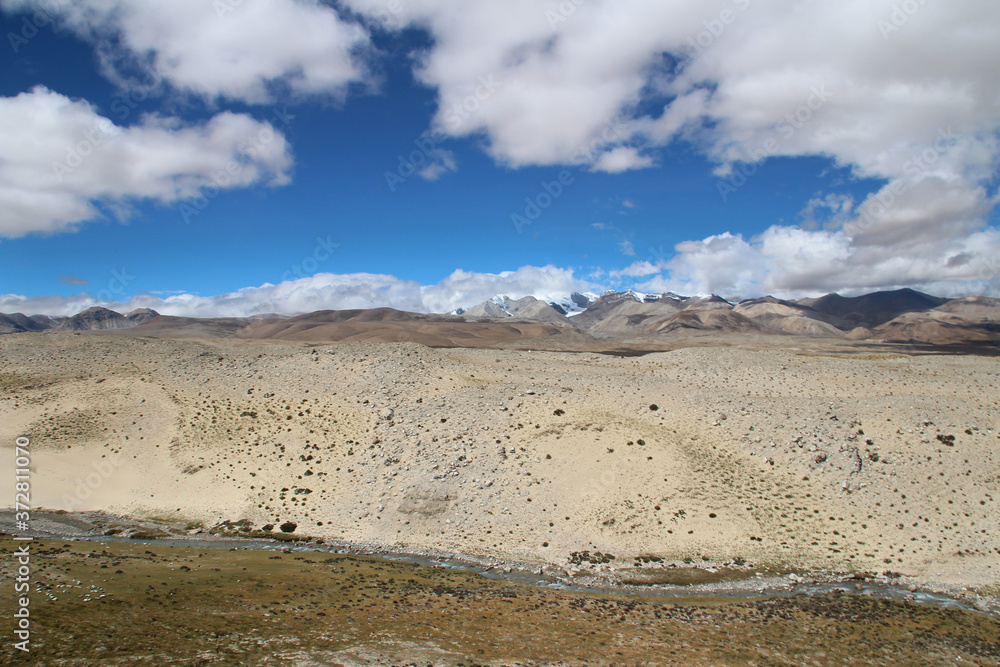 View of the mountains and river with dramatic sky on the way to Everest Base Camp, Tibet, China View of the mountains and river with dramatic sky on the way to Everest Base Camp, Tibet, China