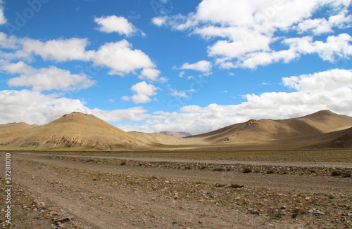 View of the mountains and dramatic sky near Tingri on the way to Everest Base Camp, Tibet, China