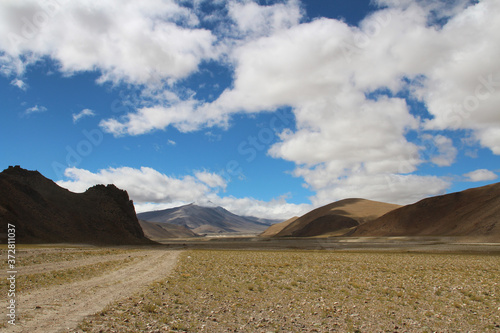 View of the mountains and dramatic sky near Tingri on the way to Everest Base Camp, Tibet, China photo